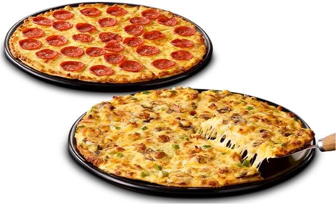Two large pizzas on black plates